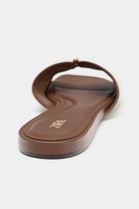 FLAT SANDALS WITH METAIL DETAILS